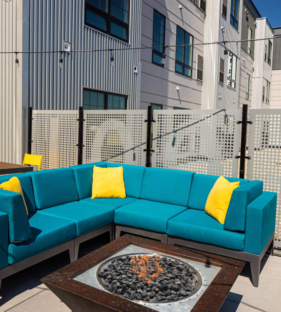 Couch on the balcony at The Landing at 1001 NP Apartments in Fargo, ND 58102