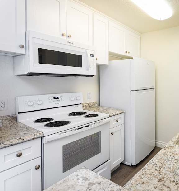 A Kitchen with White Appliances at Northridge Gardens Apartments, Northridge, 91325