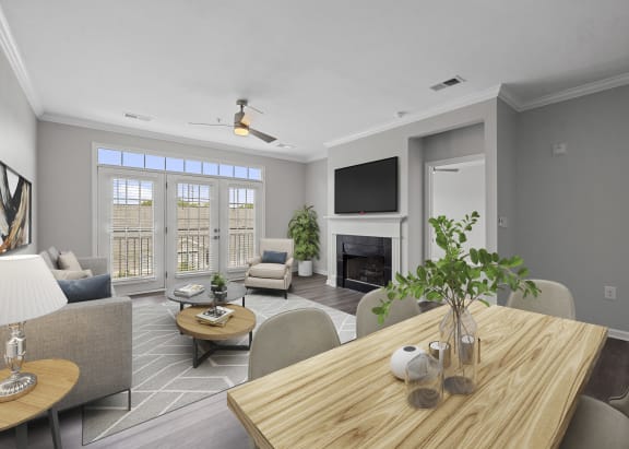 a living room with a table and chairs and a fireplace