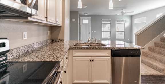 Fully Equipped Kitchen With Modern Appliances at 7th Street Brownstones, Indigo Living, Iowa