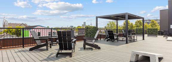 A reception area with a wooden door and a green tile counter.