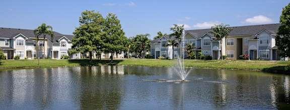 Waterfront View with Apartment Building Exterior and Trees