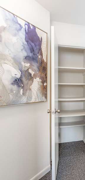 a storage cabinet in a room with lawyers hill apartments on the wall