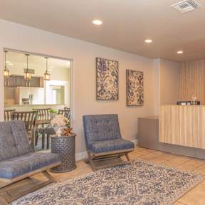 A reception area with two chairs and a reception desk.