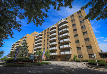 a large brick building with a blue sky in the background