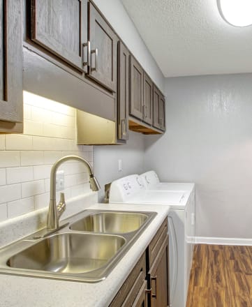 the preserve at ballantyne commons apartment kitchen with stainless steel appliances and wooden floors