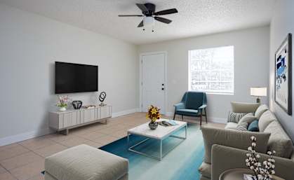 a living room with a couch and a tv