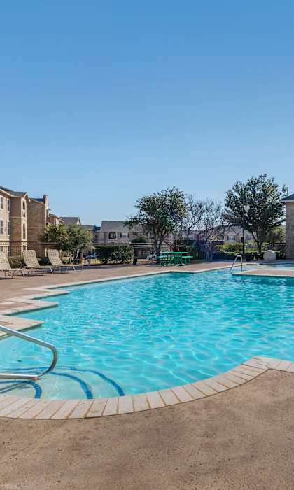 our apartments offer a sparkling swimming pool with apartments in the background