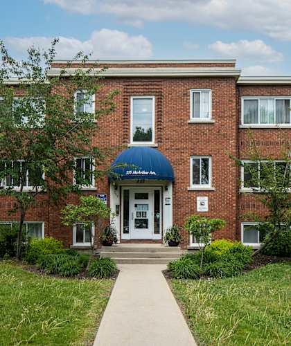 A red brick building with a blue dome entrance.