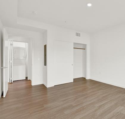 an empty living room with white walls and wood flooringat the perch, Los Angeles California