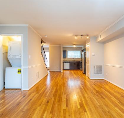 A room with wooden floors and white walls.
