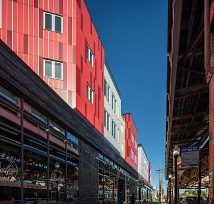 A red building with a clear blue sky in the background.