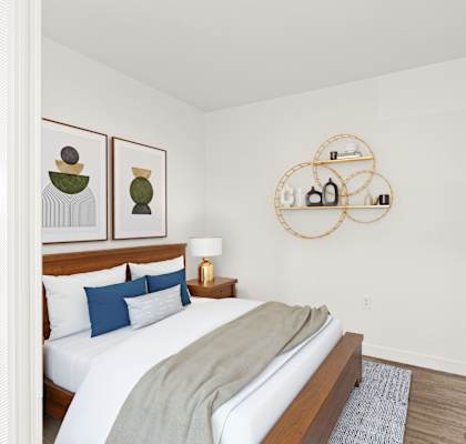 a bedroom with a bed and two night stands