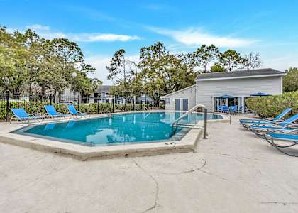 our resort style swimming pool is next to our clubhouse and has lounge chairs around it