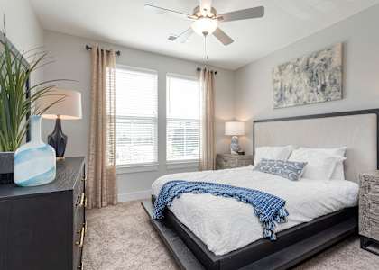 a bedroom with a large bed and a ceiling fan at Bristol at New Riverside, Bluffton, SC