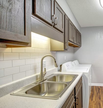 the preserve at ballantyne commons apartment kitchen with stainless steel appliances and wooden floors