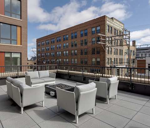 the terrace has a fire pit on the roof of the building at Mercantile on Broadway, Fargo, ND 58102