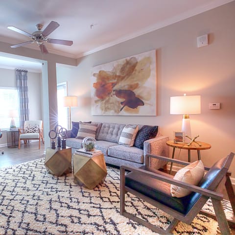 a living room with furniture and a ceiling fan  at Lullwater at Big Ridge, Hixson