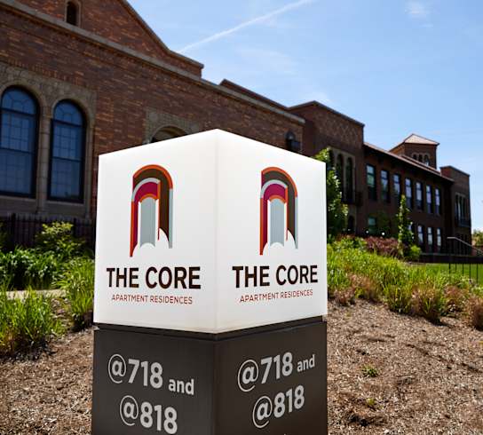 the core sign in front of a brick building