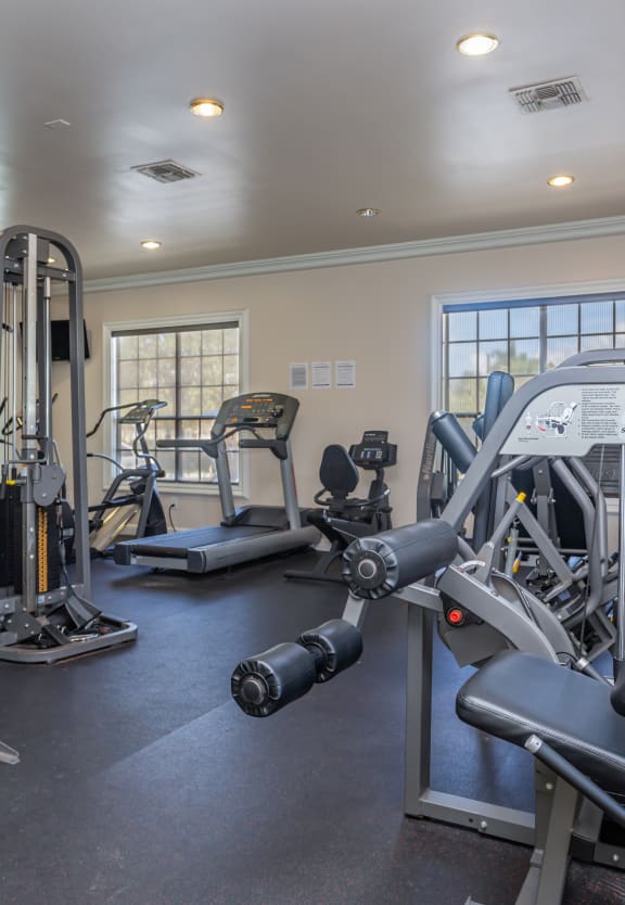 the gym at the whispering winds apartments in pearland, tx  at Bay Harbor, Fort Myers