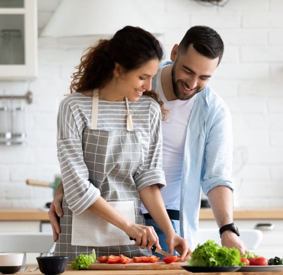 couple cooking in kitchen