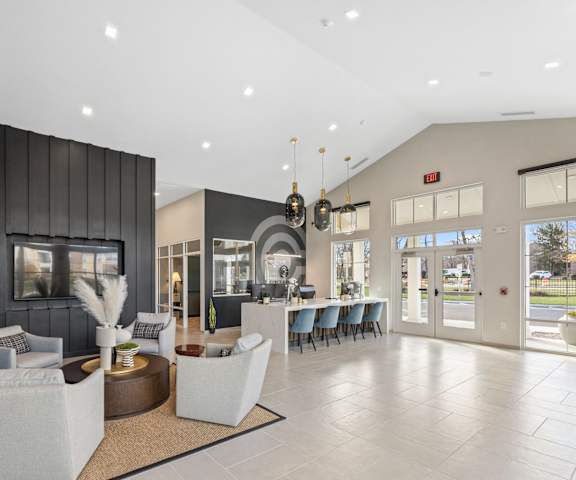 A spacious lobby with a reception desk and seating area.
