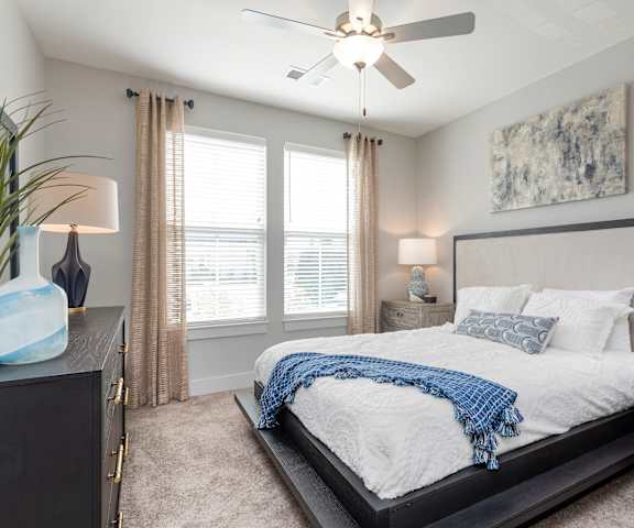 a bedroom with a large bed and a ceiling fan at Bristol at New Riverside, Bluffton, SC