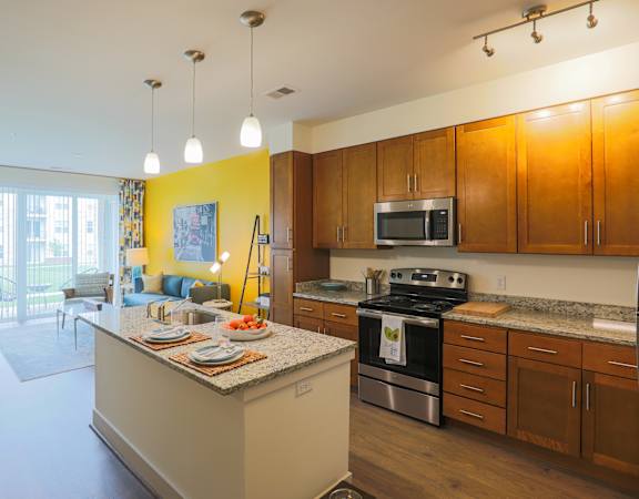 a kitchen with a center island and a stove top oven