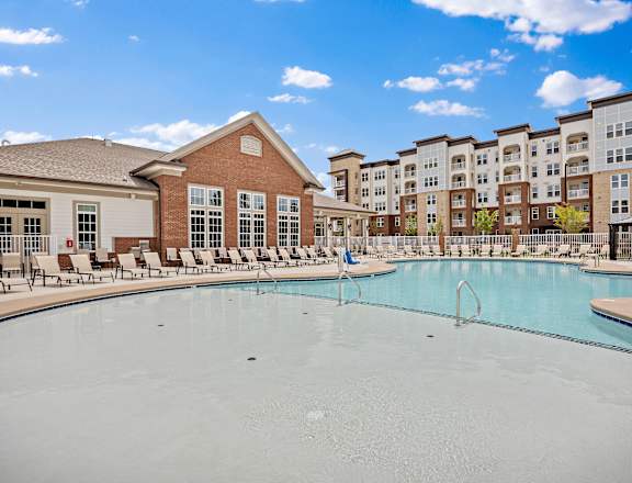 commons pool with apartment buildings at Ellis Station, Durham