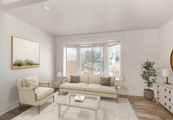 A living room with a beige couch, chair, and coffee table.