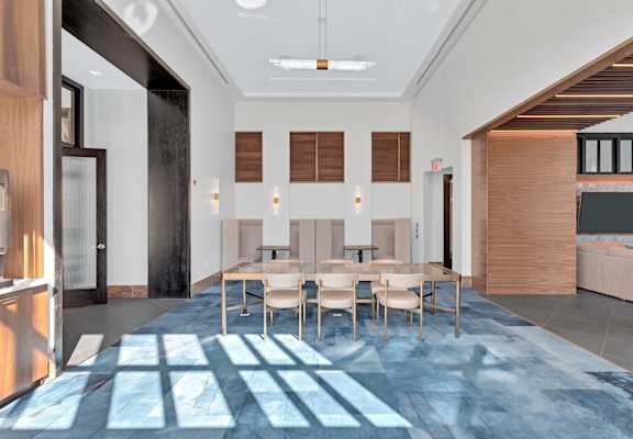a large dining room with a large table and chairs