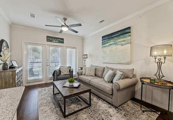 Spacious living room interior at Auberge of Burleson luxury apartments in Burleson TX.
