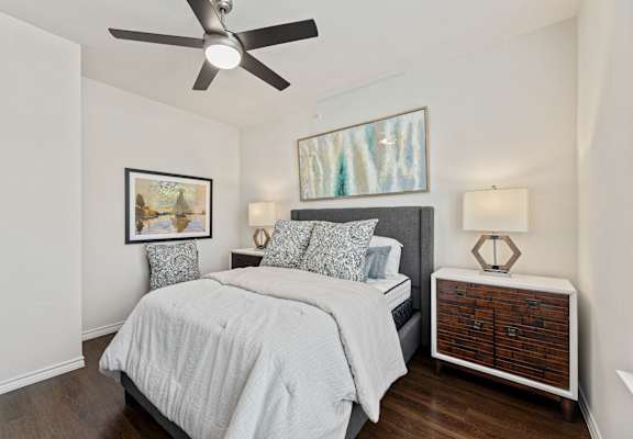 Spacious bedroom with ceiling fan at Auberge of Burleson apartments in Burleson TX.