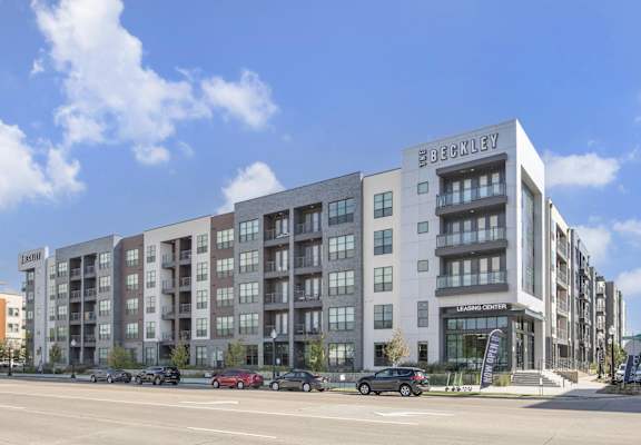 a rendering of an apartment building on a city street