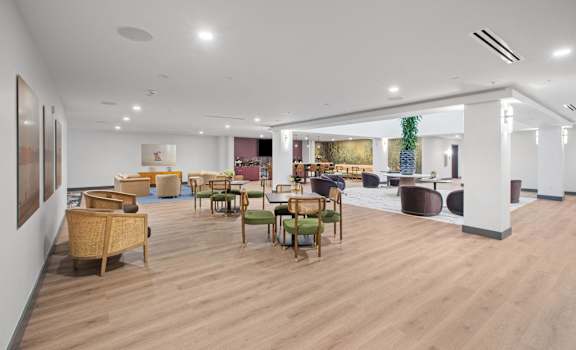 A room with wooden floors and furniture.