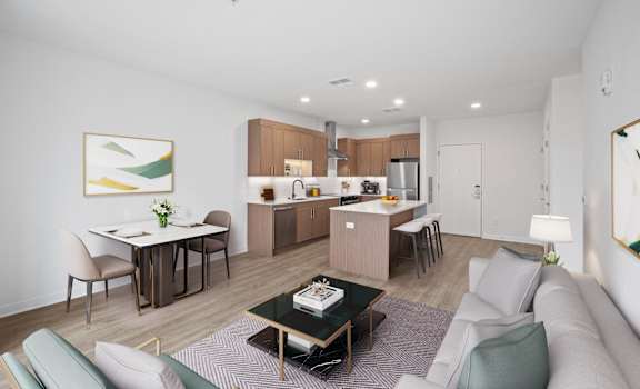A modern living room with a dining area and kitchen in the background.