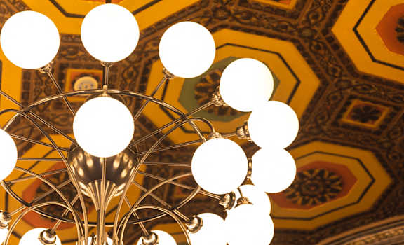 a chandelier with white lights hanging from the ceiling at The Press/321, Detroit MI