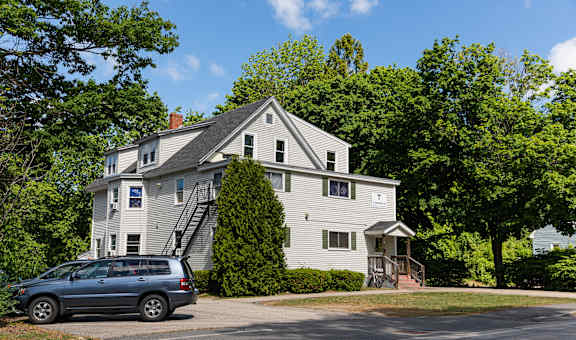 a van parked in front of a house