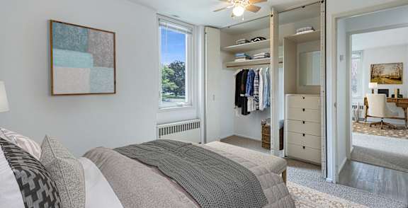 a dining room with a table and chairs and a kitchen at Humboldt Senior 55+ Apartments, Saint Paul, MN, 55107