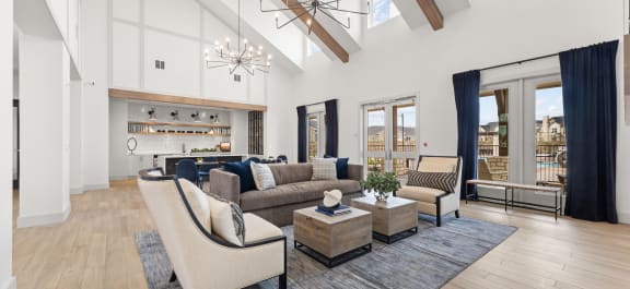 a living room with couches and chairs and a rug