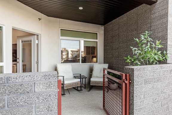 Patio with a white chair at The Vue At Desert Color, Utah, 84790