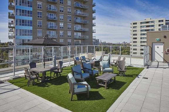 A terrace with tables and chairs on a sunny day