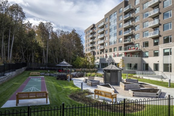 Outdoor park area in Foxview Retirement Community with games and sitting areas.