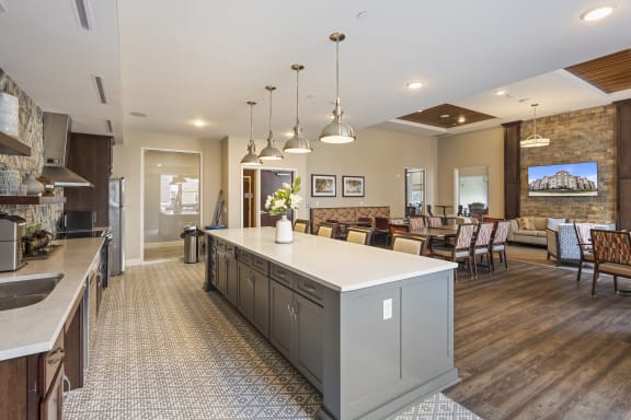 a large kitchen with a center island and a dining room