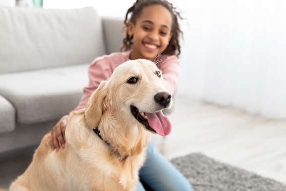 Girl with dog at Vivir at Ballpark Village Apartments, Goodyear, 85338