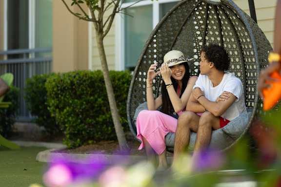 a woman lying on a bench with her dog at Proximity at ODU, Norfolk, Virginia