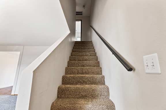 a view of the stairs leading up to the second floor