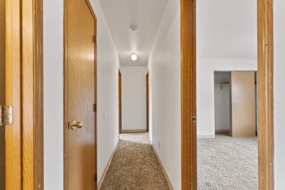a bedroom with a medium sized bed and a closet