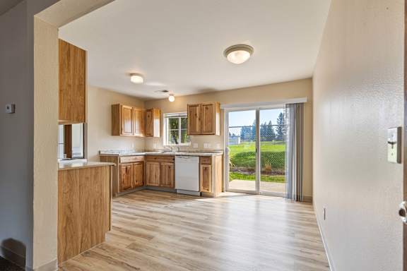 a kitchen and living room in a 555 waverly unit
