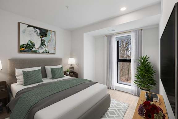 A bedroom with a large bed and a painting on the wall.